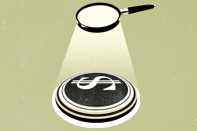 A magnifying glass shines a spotlight on the Department of Government Efficiency logo.