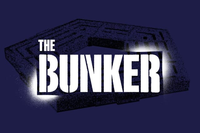 The Bunker logo, done in military stencil, in front of the Pentagon building