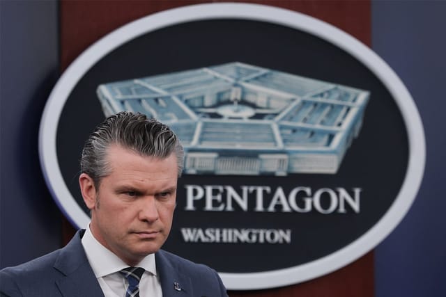 U.S. Secretary of War Pete Hegseth looks on during a press briefing at the Pentagon on March 19, 2026 in Arlington, Virginia.