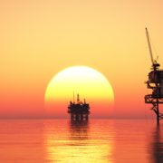 Offshore oil rigs at sunset