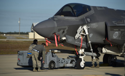 A U.S. Air Force weapons load crew loads a live AIM-120 advanced medium-range air-to-air missile into an F-35A January 31, 2017, at Eglin Air Force Base, Florida.